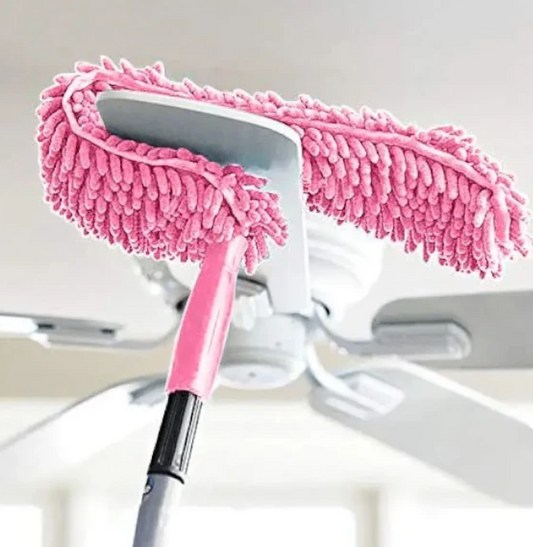 Pink car cleaning brush with a white background