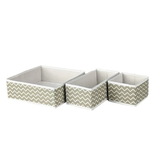Three storage boxes with chevron pattern on a white background