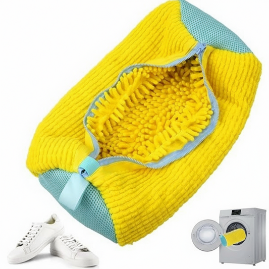 Yellow shoe pouch with blue accents, white sneakers, and a washing machine on a white background.