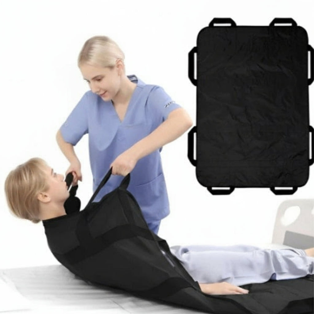 Person in blue scrubs assisting a person lying on a black stretcher with straps.