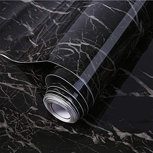 Roll of black marble patterned contact paper on a black marble background