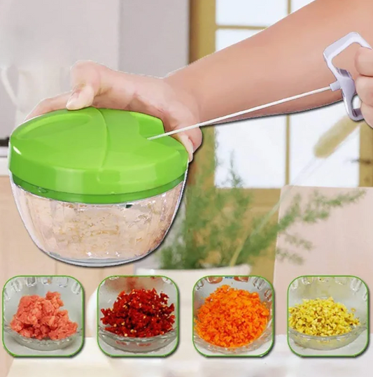 Handheld food chopper with chopped vegetables displayed in small bowls.