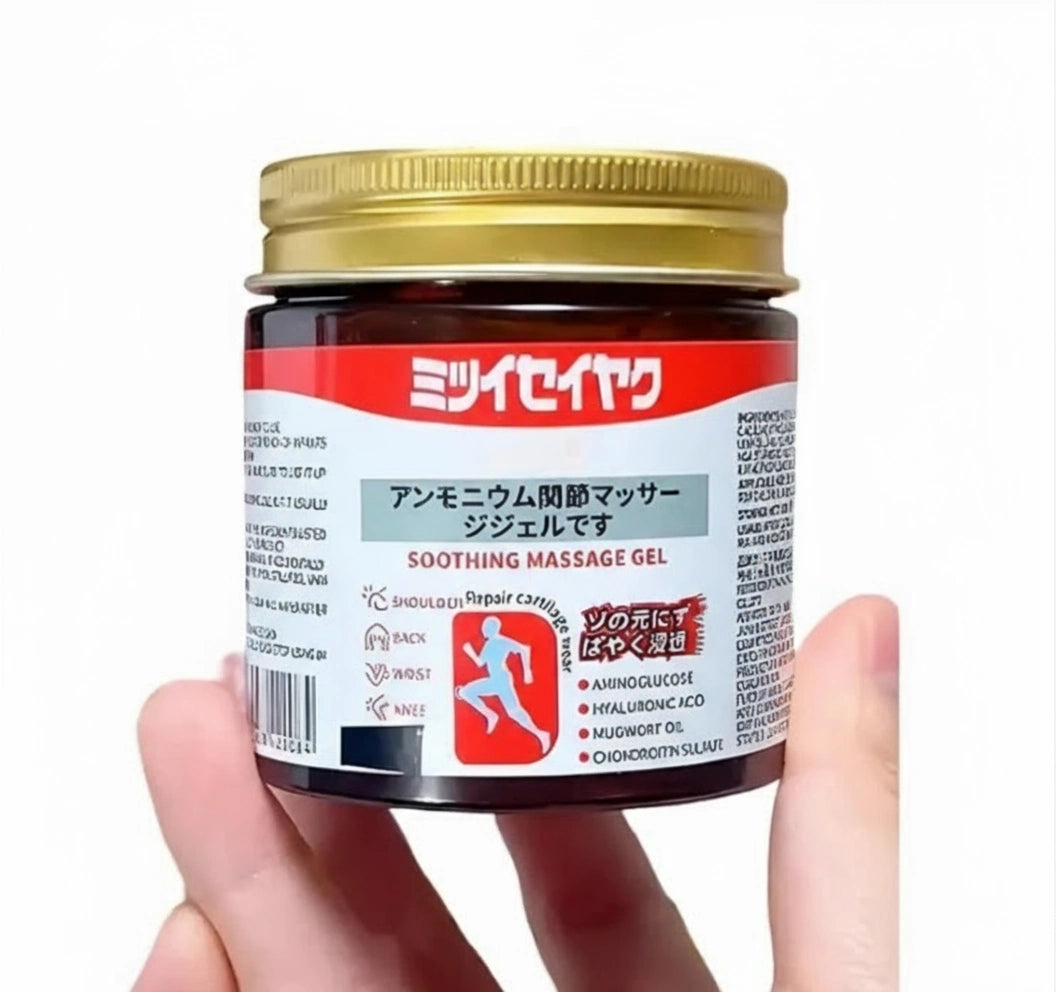 Hand holding a jar of soothing massage gel with a visible label on a white background