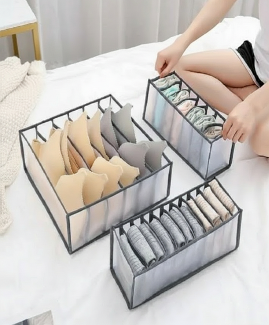 Set of three clear organizer boxes with underwear on a white surface, labeled 'EASY HOME'.
