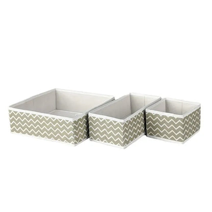 Three storage boxes with chevron pattern on a white background