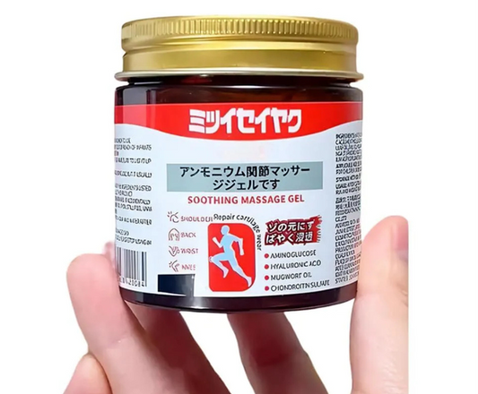 Jar of soother massage gel with a red label held by a hand on a white background