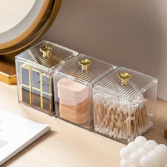 Clear acrylic organizer with gold accents on a wooden surface, featuring Lazy Shop branding.