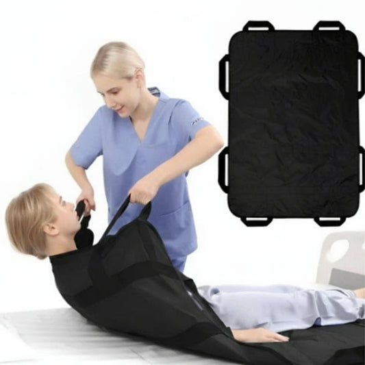 Person in blue scrubs assisting a person lying on a black stretcher with straps.